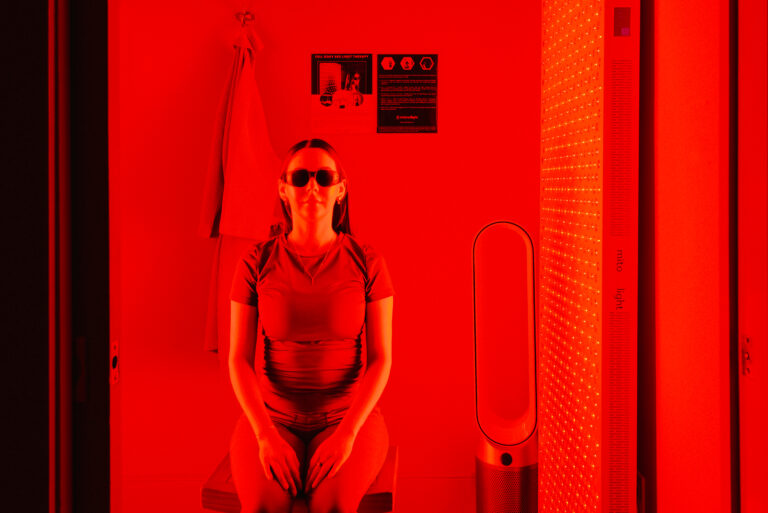 Sitting woman during Red Light Therapy in New Orleans
